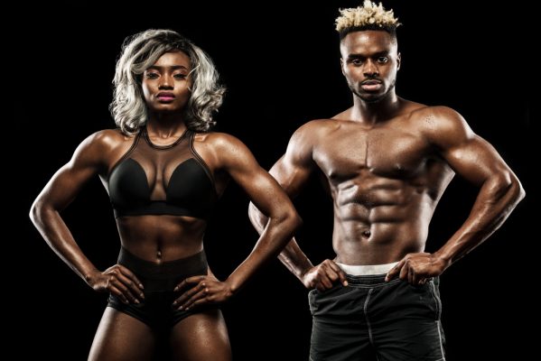 Fitness,Couple,Of,Athletes,Posing,On,Black,Background,,Healthy,Lifestyle